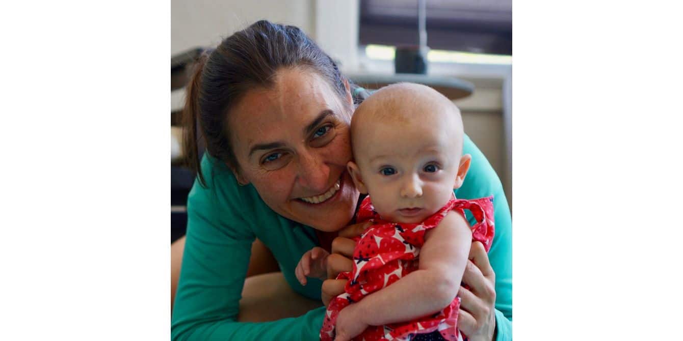Jessica on depression and anxiety during pregnancy mom holding a baby for the camera - an essay on depression and anxiety during pregnancy