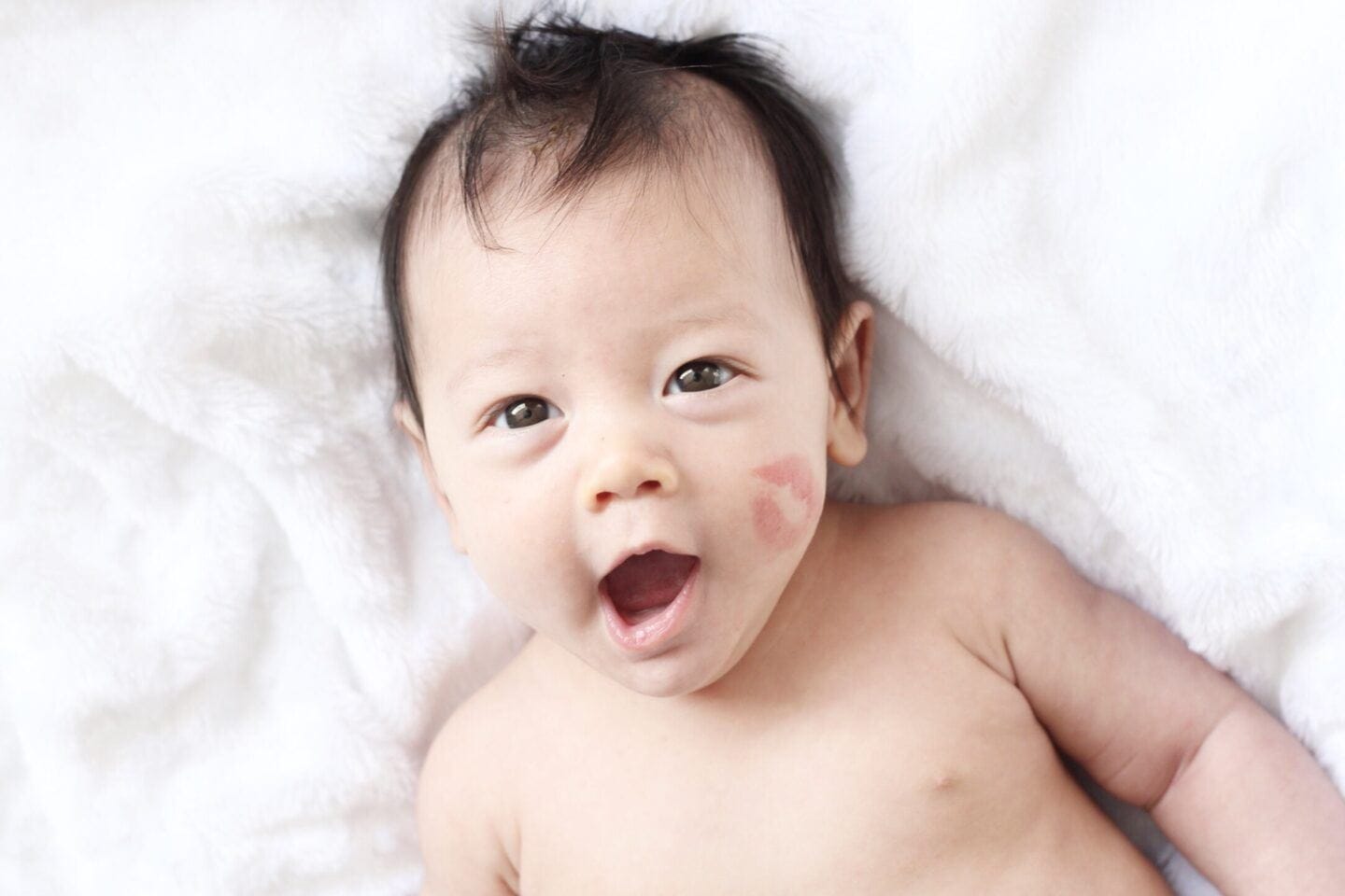 6 reasons February babies are special February baby with lipstick on cheek- february babies