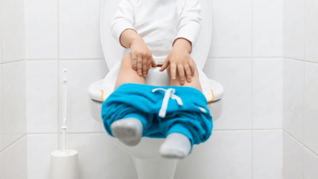 Doctor-approved ways to help ease constipation in children child sitting on the toilet