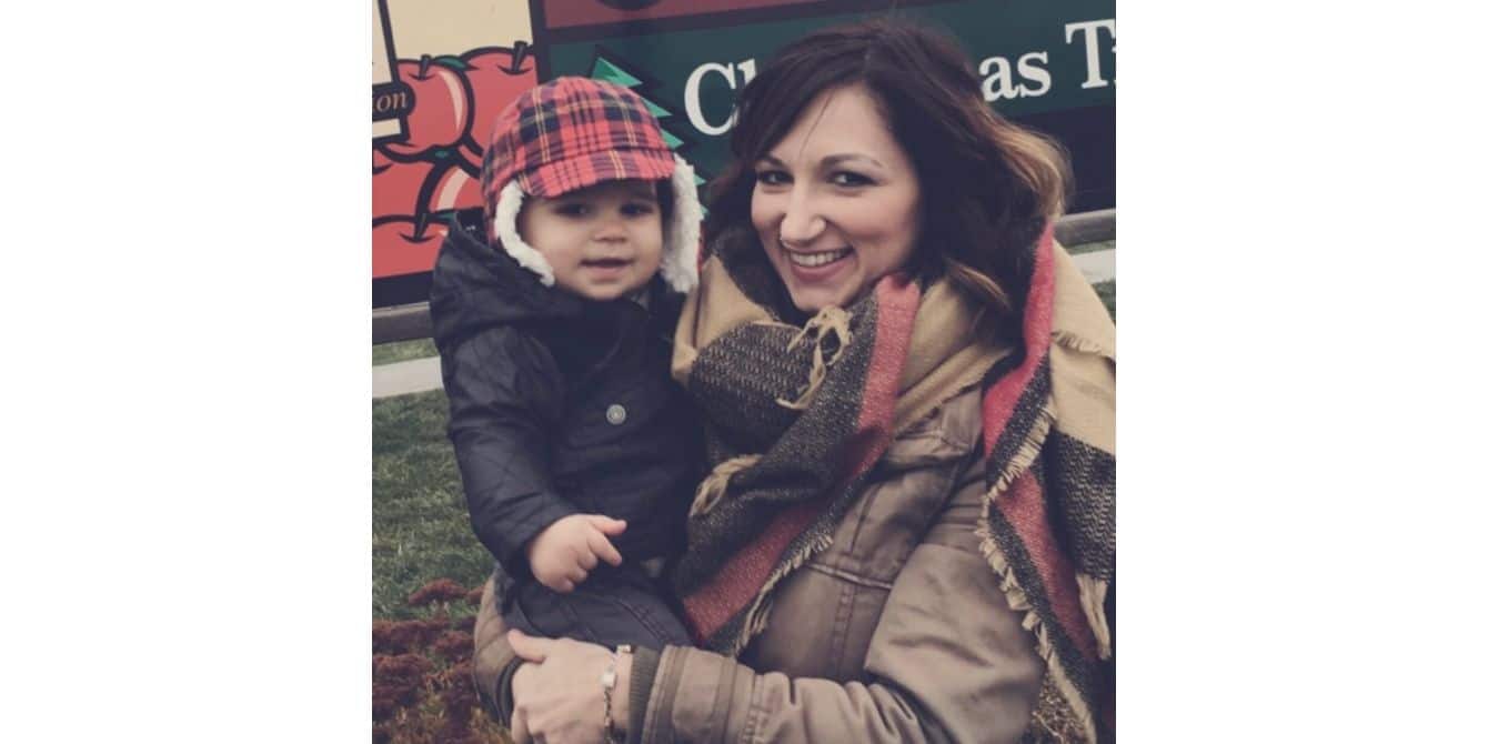 Cassandra on battling postpartum depression, OCD and PTSD mom holding her toddler at a pumpkin patch - battling postpartum depression