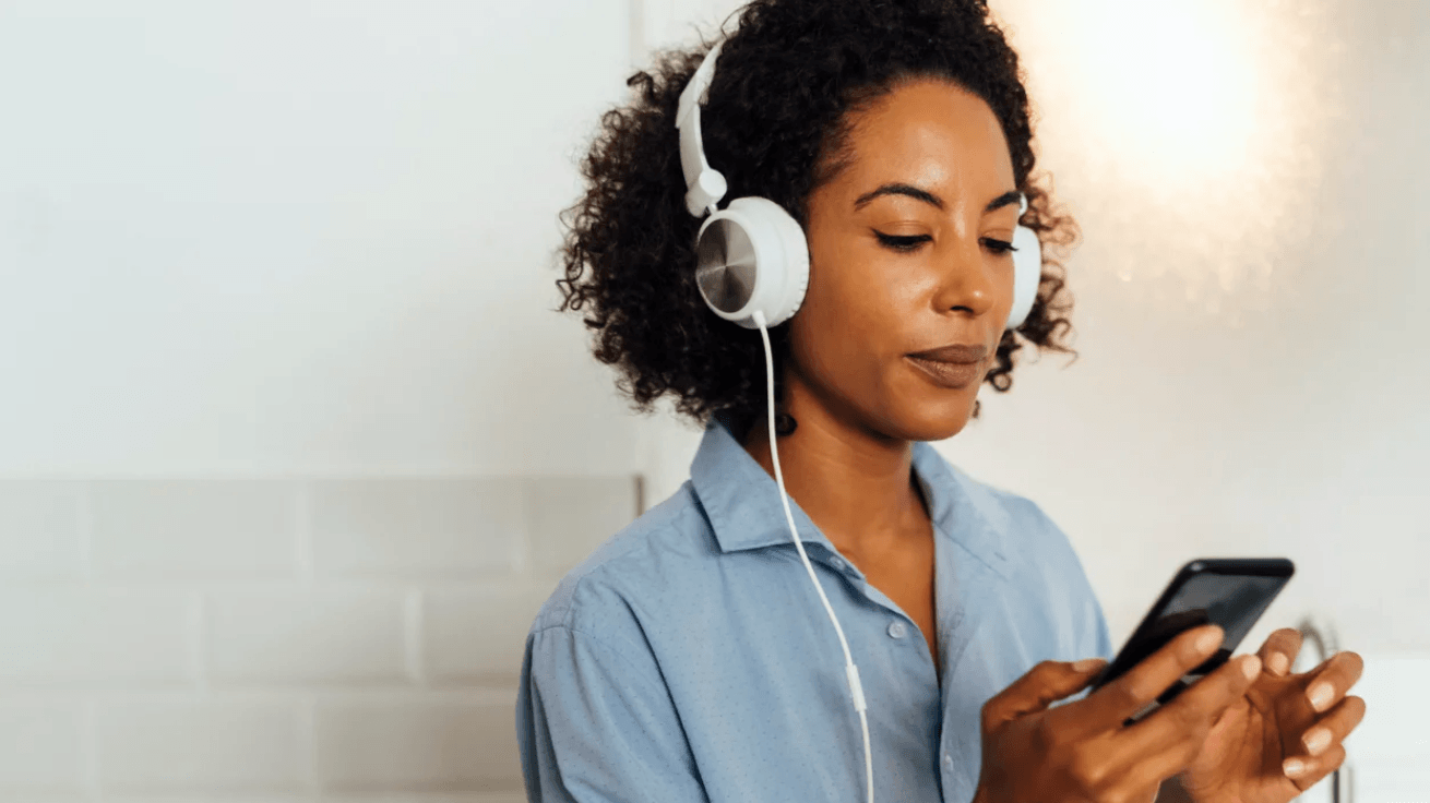 9 audiobooks to listen to when you need a break woman listening to an audiobook