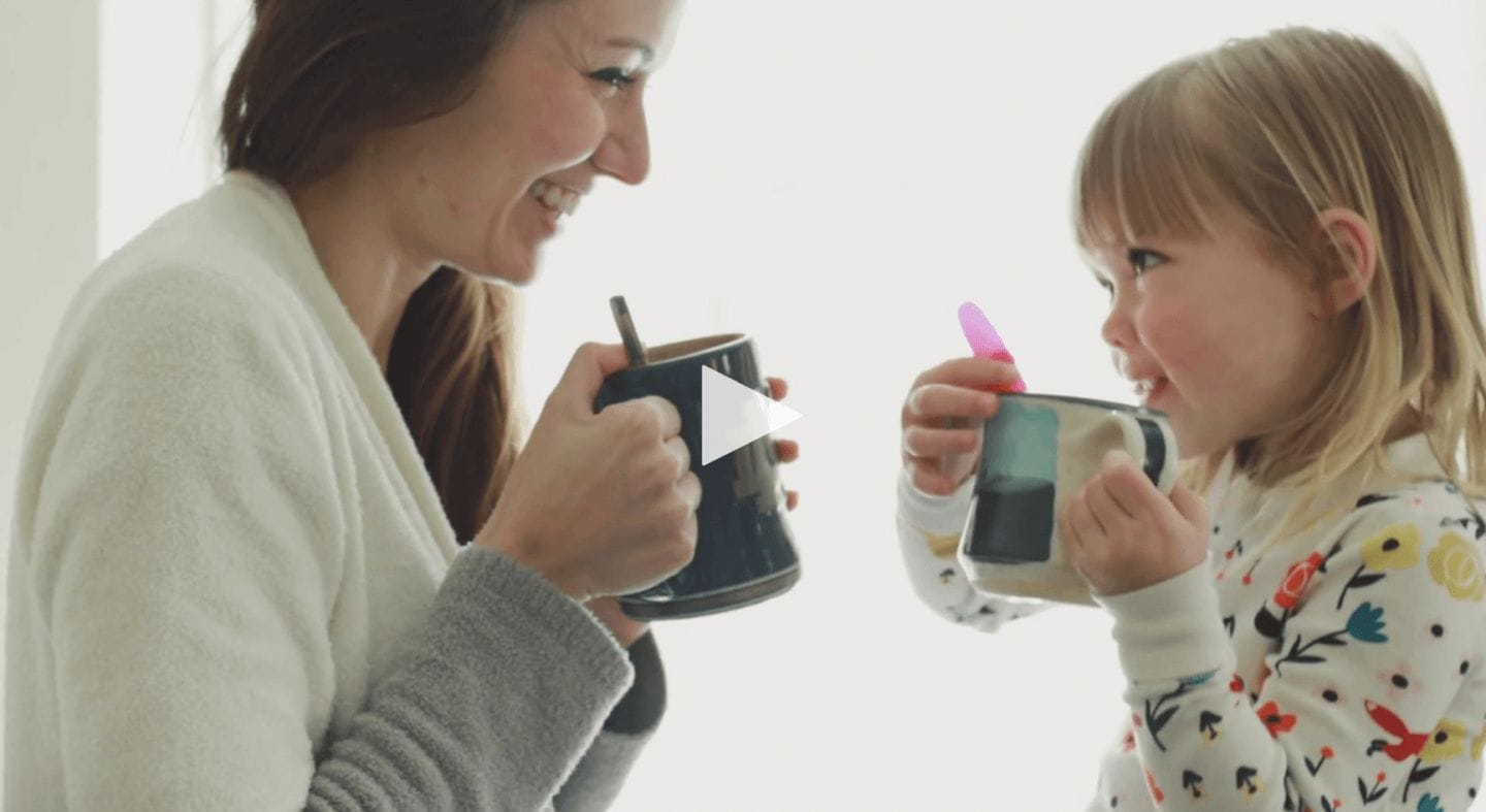 This heartwarming music video about motherhood is giving us all the feels mom and daughter holding cups together