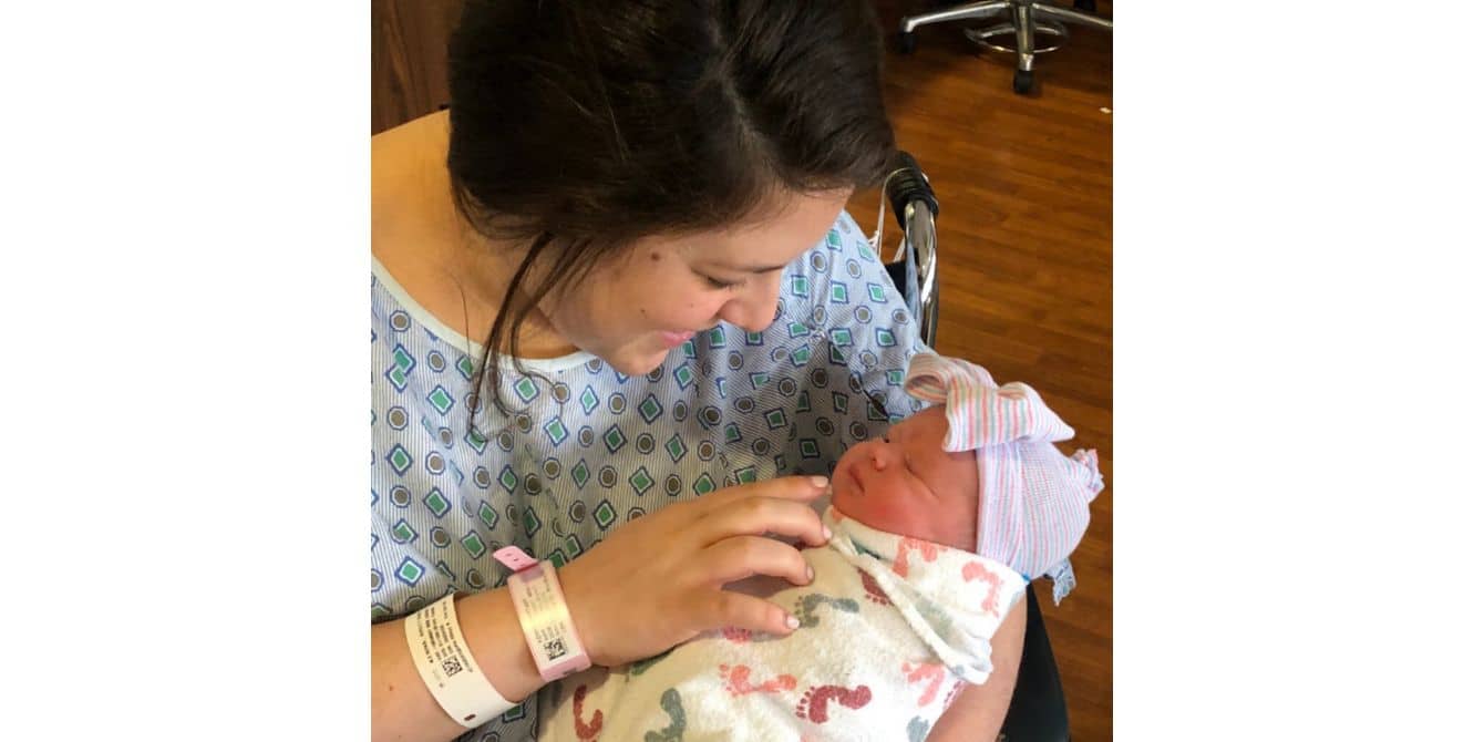 Brittany on finding help at the Alexis Joy D’Achille Center for Perinatal Mental Health mom looking down happily and newborn baby - Perinatal Mental Health
