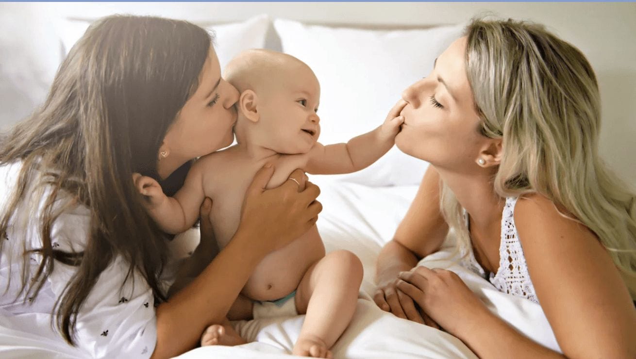 Oh, there you are! woman hold baby and another woman kissing baby's hand