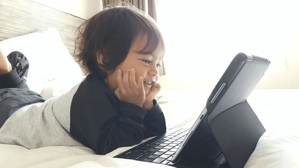 17 apps to educate & entertain toddlers toddler watching a tablet