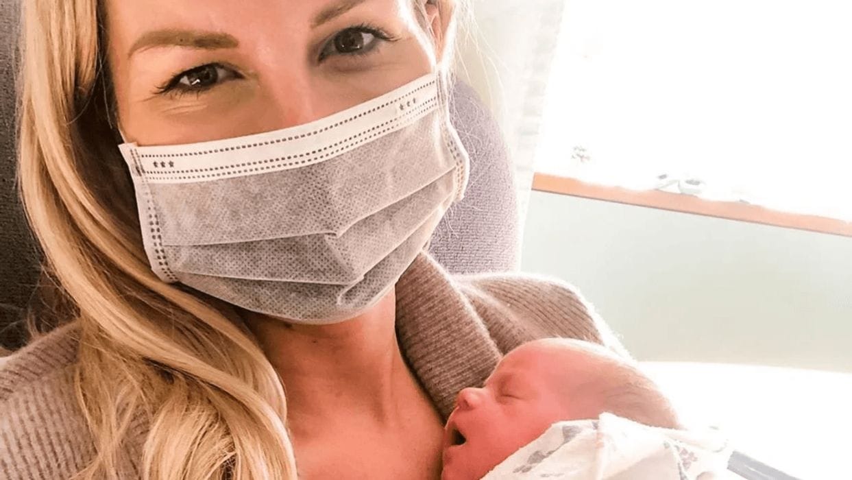 These stories of mothers reunited with babies born during COVID-19 will make you 😭 mom wearing a mask holding newborn baby