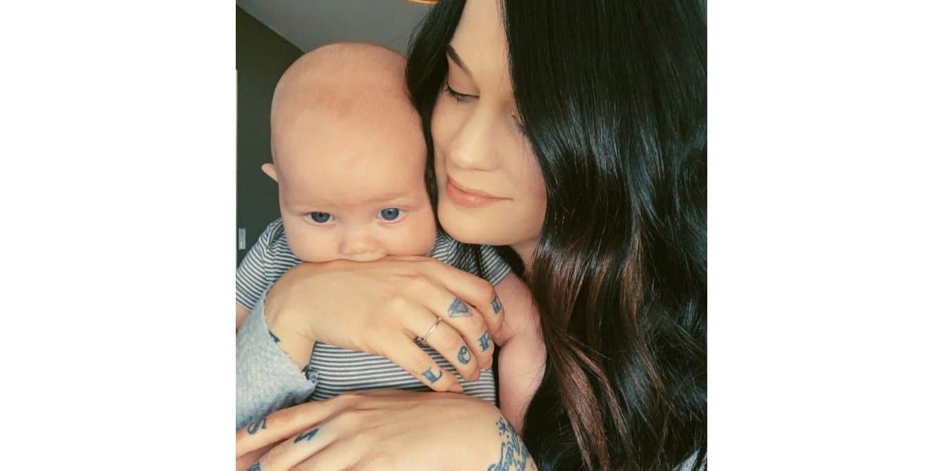 Laurel on checking into a psychiatric unit for postpartum depression baby with moms hand in his mouth - essay on seeking help for postpartum depression