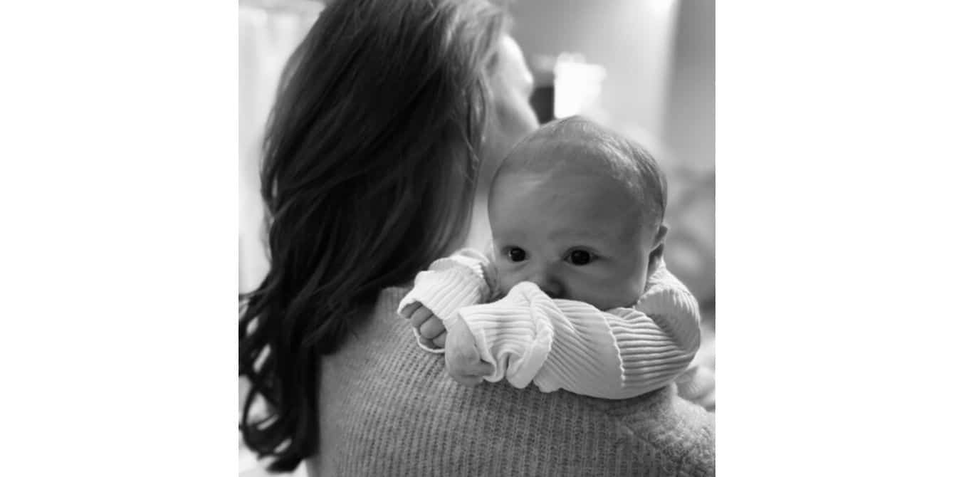 Becky on loss followed by postpartum depression during a pandemic baby in moms arms - essay on postpartum depression during Covid