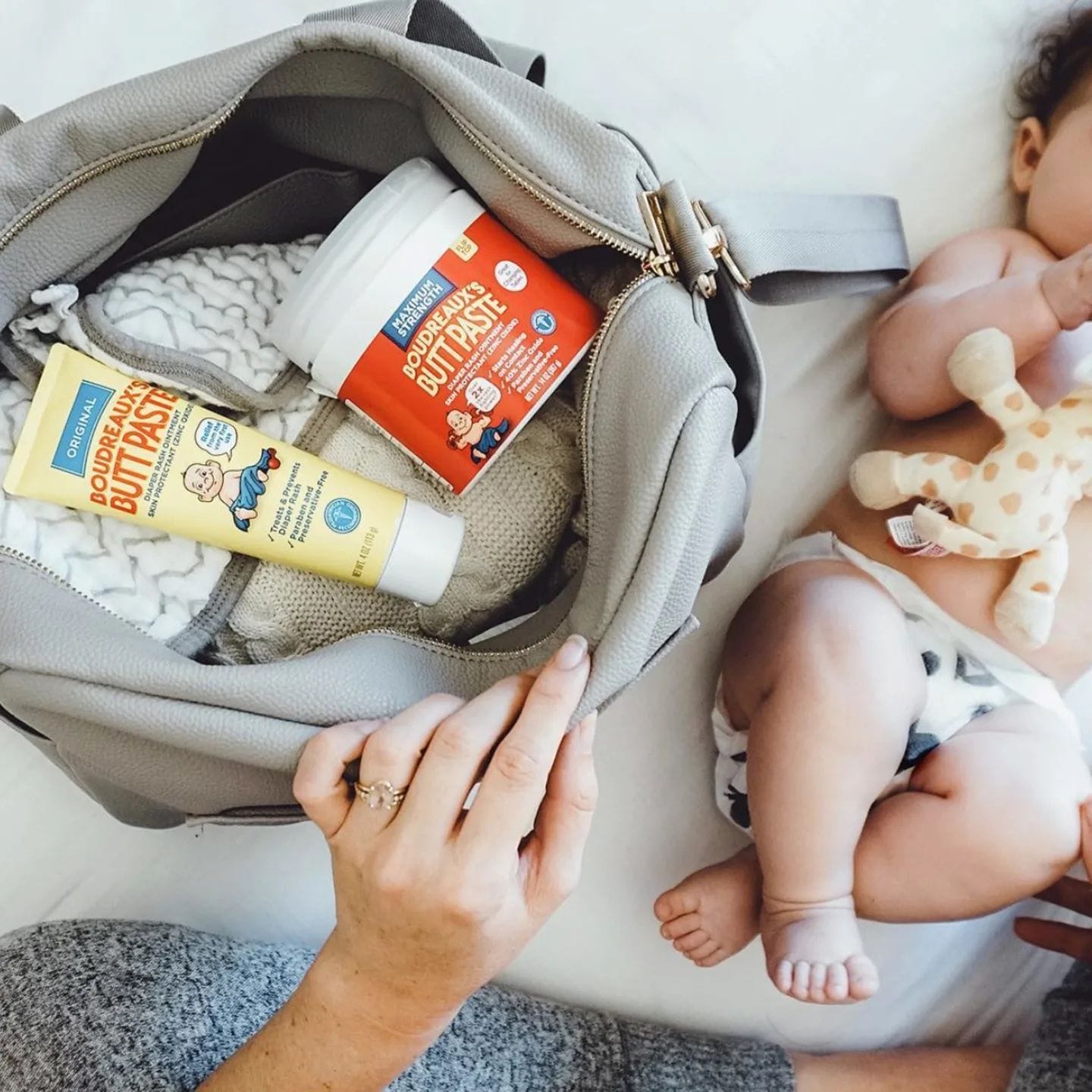 14 diaper rash creams that *really* work mom opening diaper bag to diaper cream