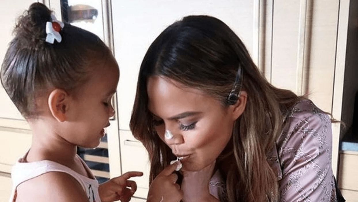 5 refreshing summer recipes straight from Chrissy Teigen’s kitchen Chrissy Teigen kissing daughter's finger
