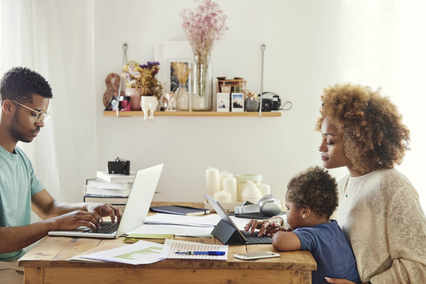 We answered parents’ most important questions about COVID-19 parents-on-computers-with-toddler-on-moms-lap
