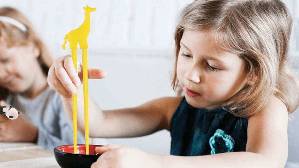 12 innovative products that make meals less stressful for moms child eating with toddler tongs