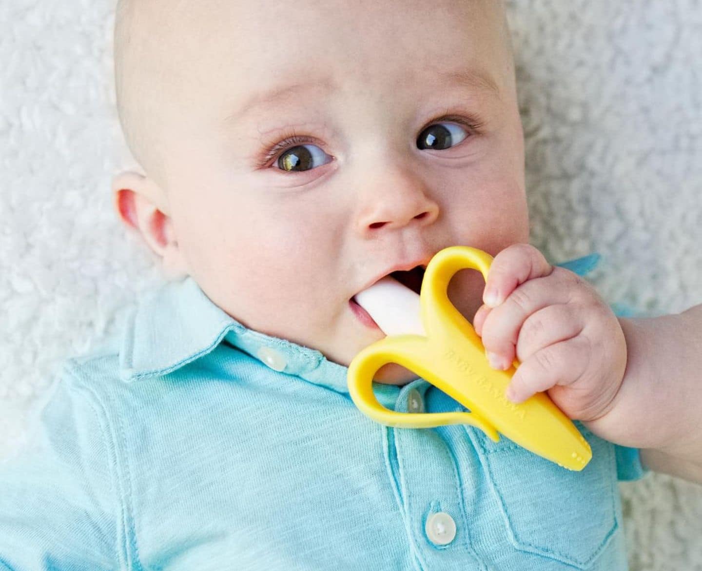 12 well-designed baby teethers to soothe even the crankiest gums baby chewing banana teether, one of the best teething toys for babies