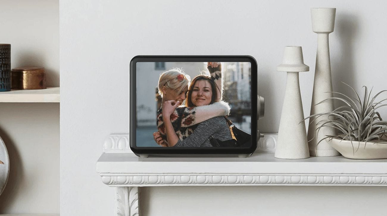 My parents miss their grandkids so much–so we gave them this Loop digital frame sitting on a mantle