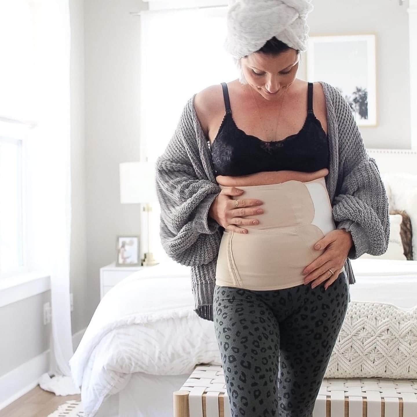 Is the Belly Bandit helpful for postpartum recovery? woman wearing belly bandit
