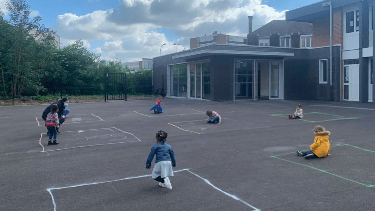These viral photos show what reopening school looks like in other countries kids playing on a playground