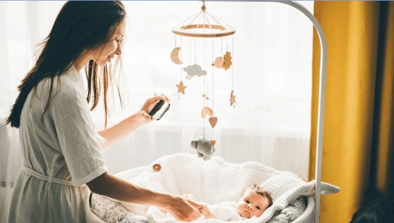 These are the 25 most popular baby registry products at Target mom taking a picture of a baby in her bassinet