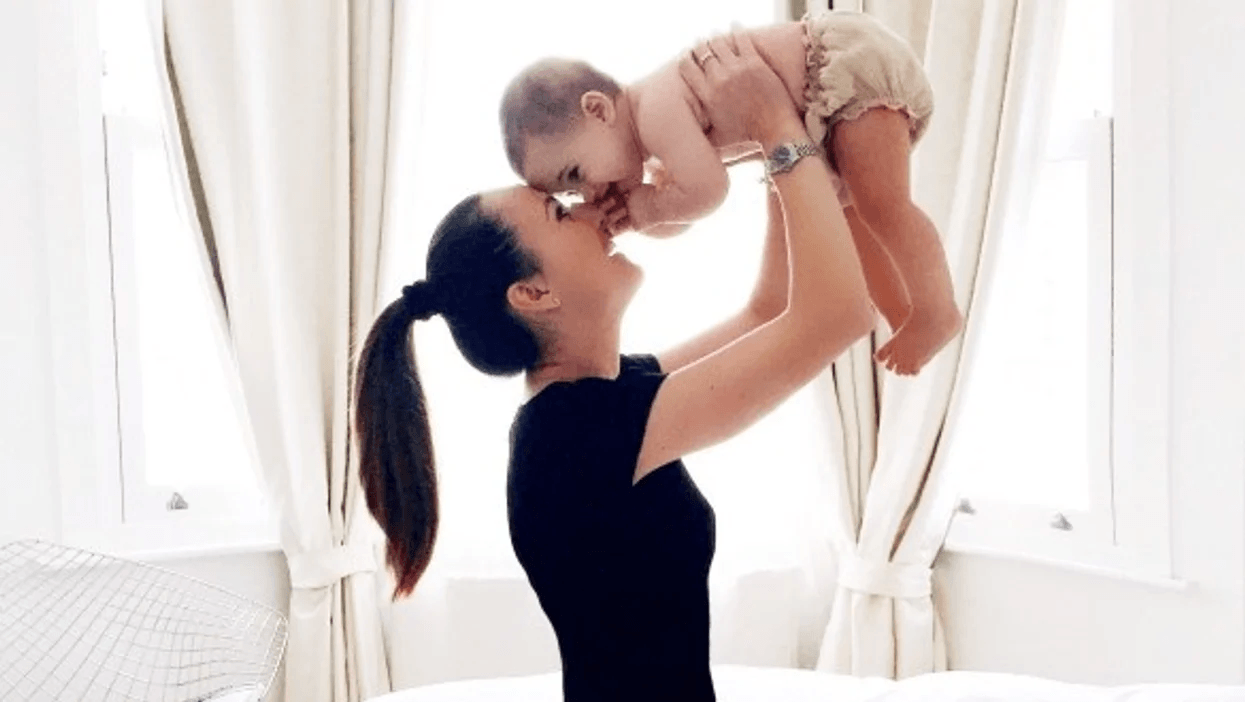 My village lives far away—but my Target baby registry helped them support me from afar mom playing with baby holding her above her head