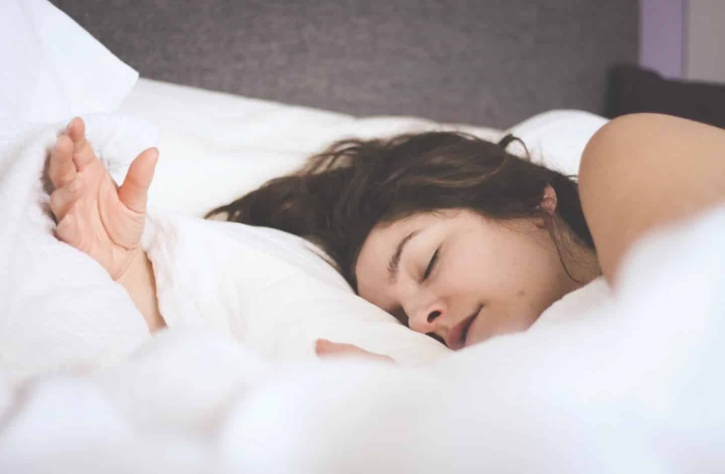 Dear exhausted mama, you deserve to rest woman sleeping in a bed