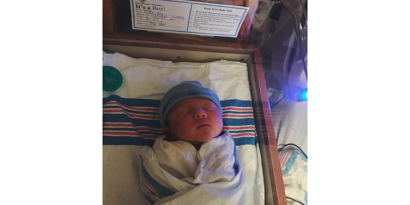 Kayleigh on her anxiety about giving birth during a pandemic baby swaddled in a hospital - essay about giving birth during a pandemic