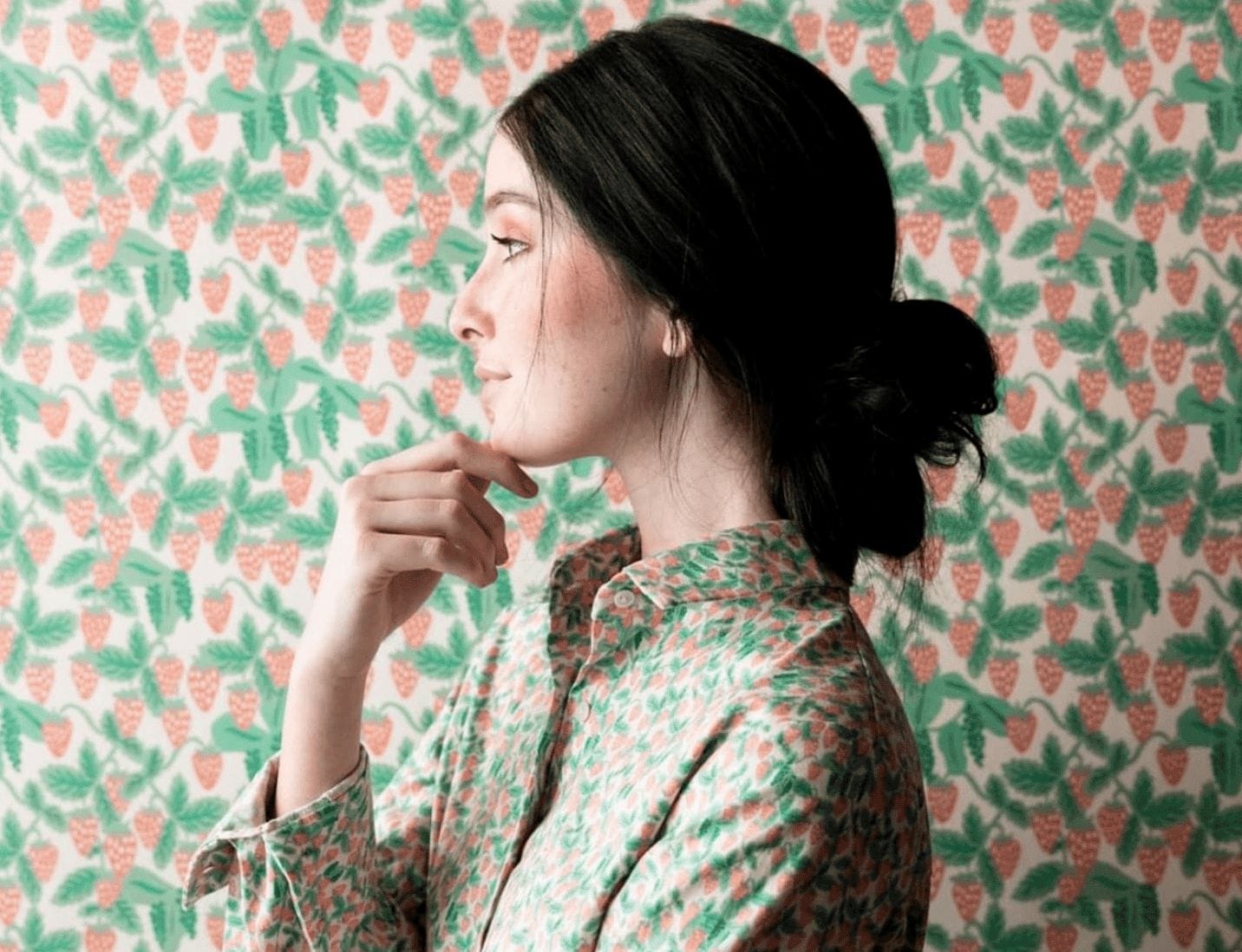 I wallpapered our house and I have no regrets woman standing in front of wallpaper wearing a matching shirt