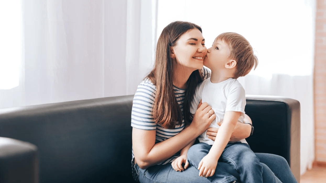How should stay-at-home parents save for retirement? little boy kissing mom on the cheek