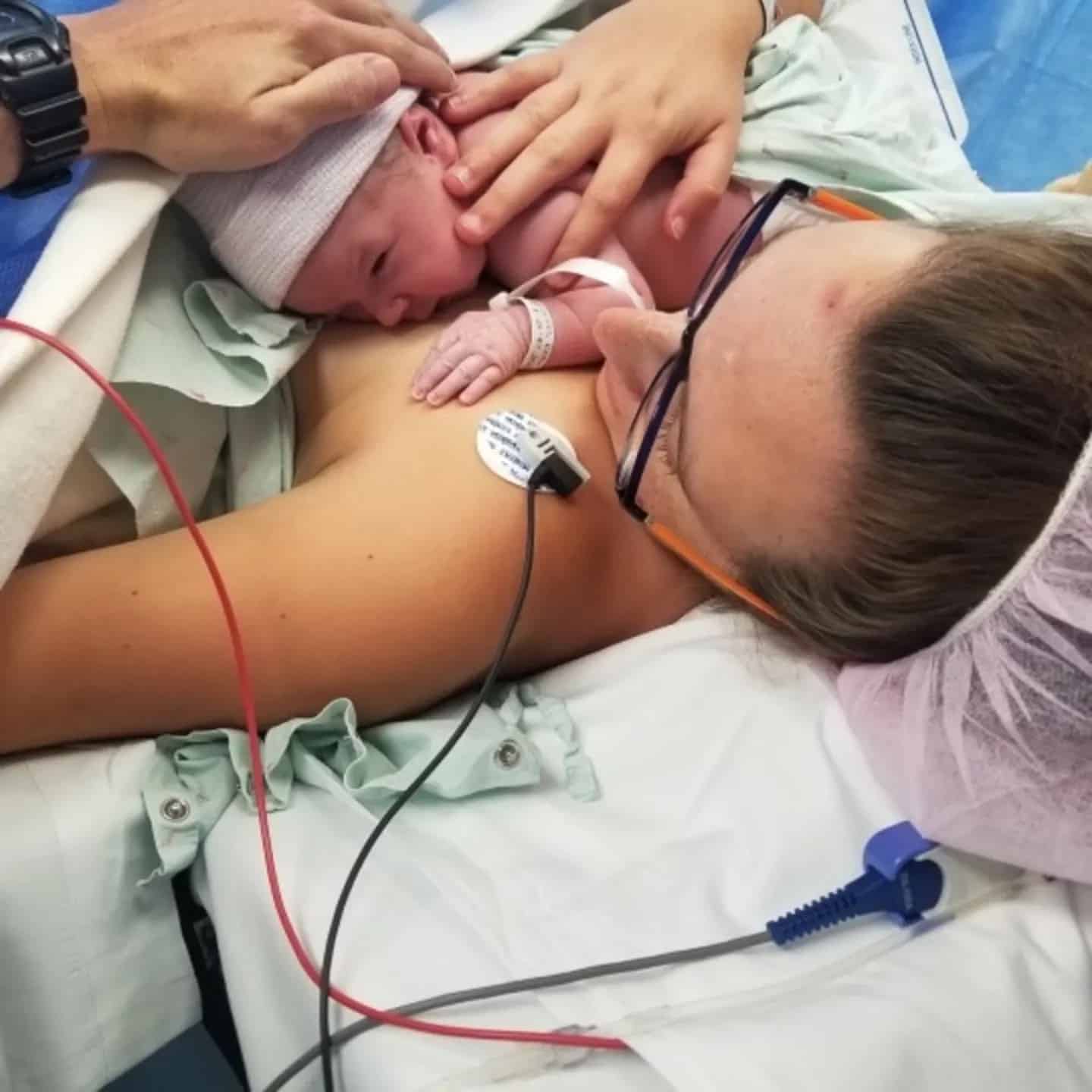 My birth story: What my unplanned C-section taught me about motherhood mom with baby on chest has unplanned c-section