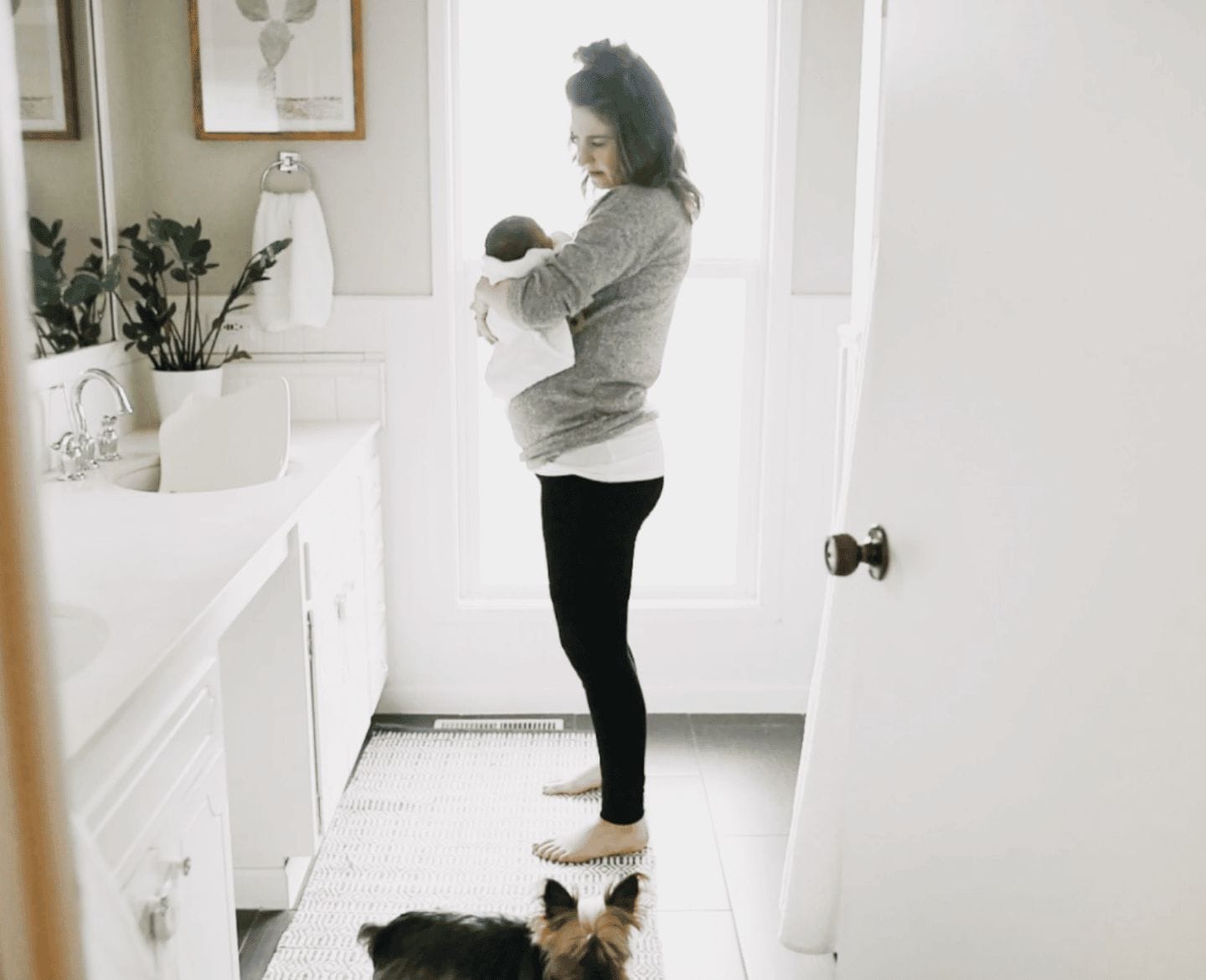 I was going to fold the clothes but instead I held you Woman holding baby