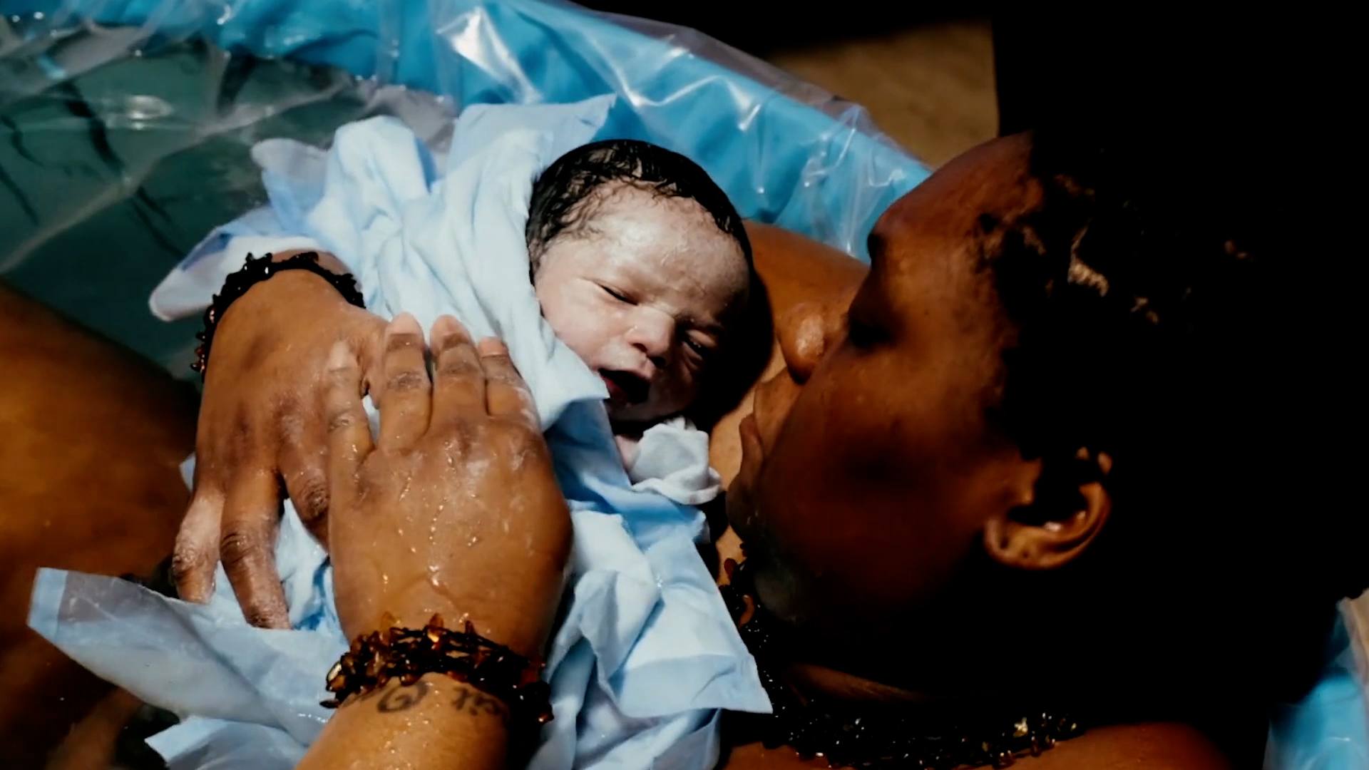 This is birth: An HBAC story mom holding newborn baby