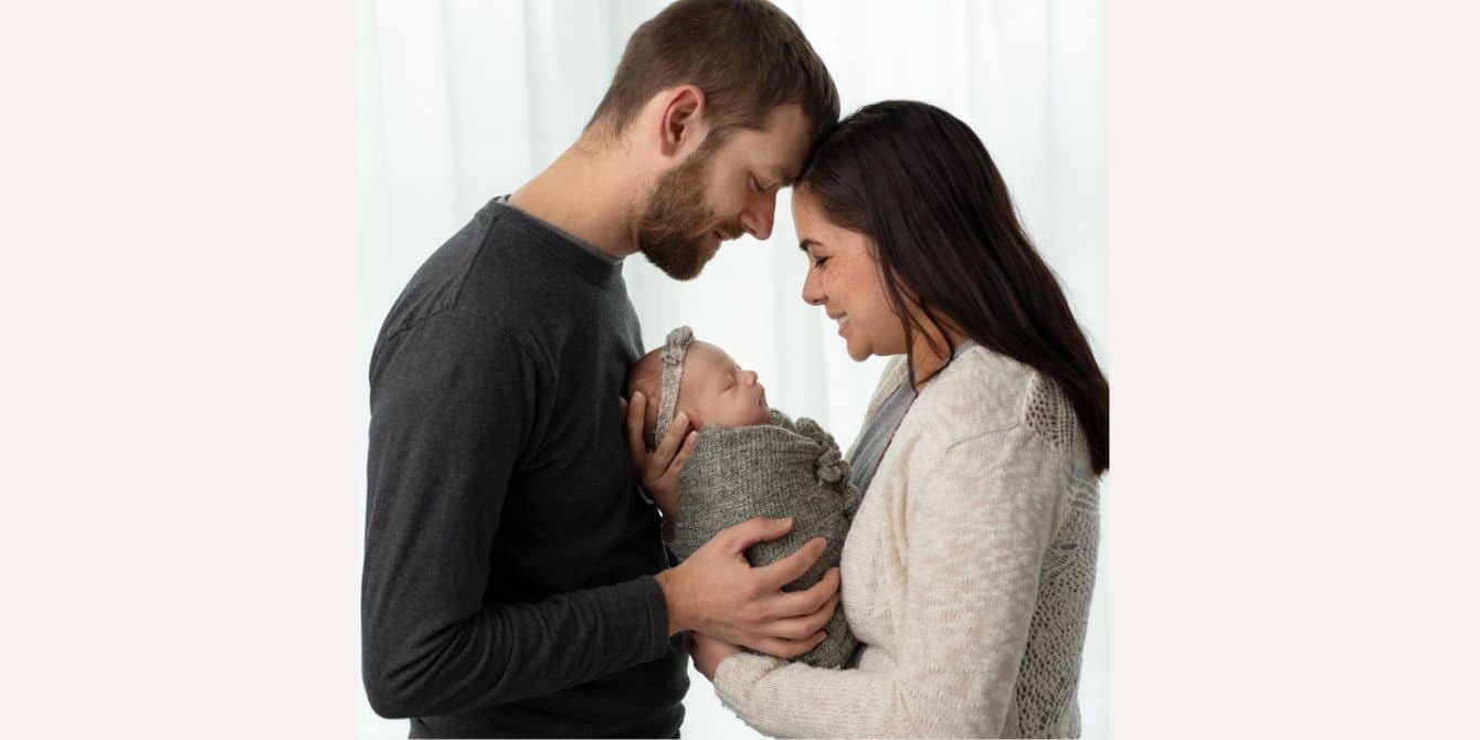 Jeanette on getting help for postpartum depression, anxiety and intrusive thoughts family newborn photo of mom and dad holding newborn daughter - essay on getting help for postpartum depression