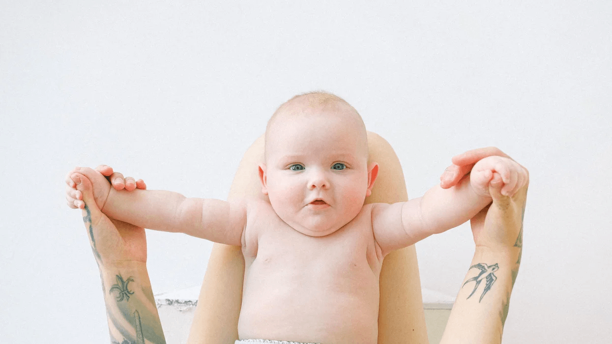 The most popular baby names of 2020 little baby held up by moms arms