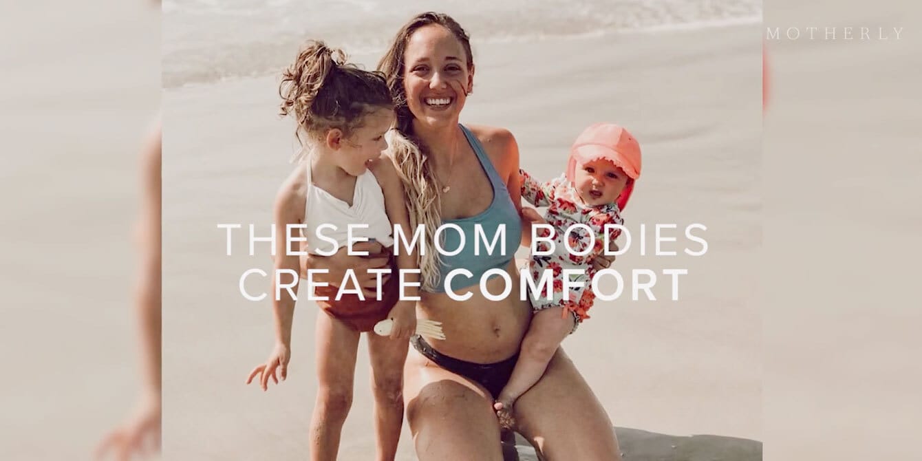 Here’s to celebrating mom bodies mom holding her two kids at the beach
