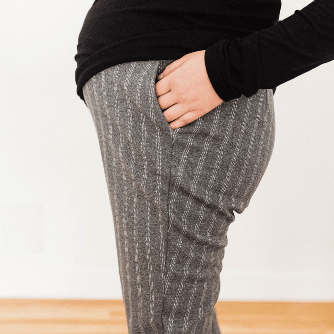 In praise of elastic-waist pants—the one good thing about 2020 woman wearing elastic pants with hands in pockets