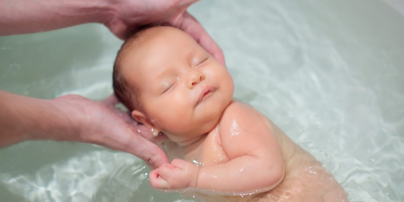 30+ Aquarian-inspired baby names for your little water bearer newborn baby being held in bathtub water acquarius names