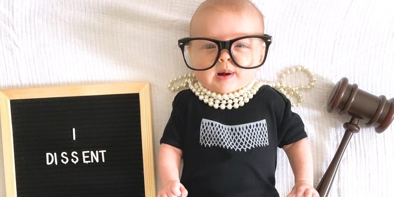 50 baby names inspired by women who have changed the course of history cute baby dressed as rbg with pearls and glasses on- famous women in history
