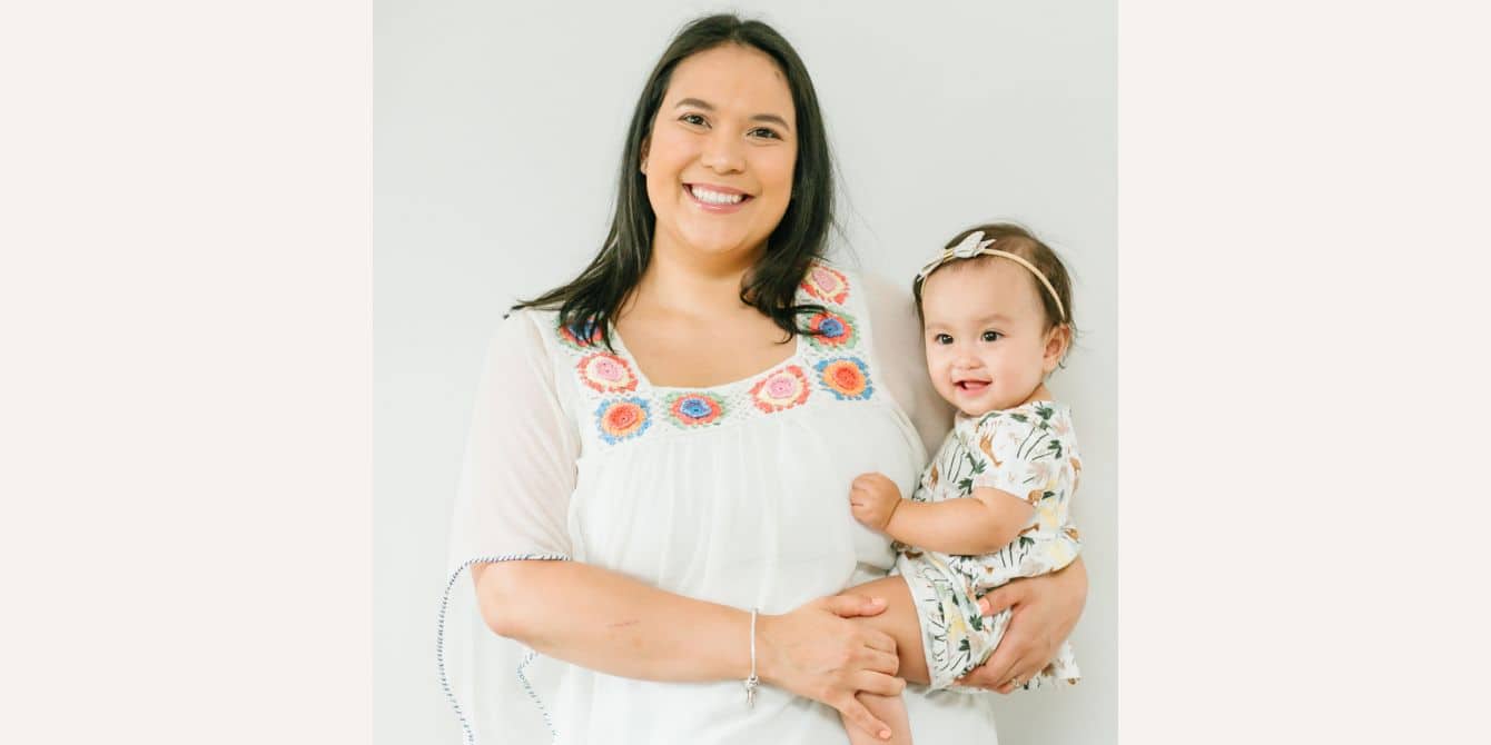Cassandra on surviving a traumatic birth followed by PPD during a pandemic mom holding her baby-essay on mom surviving a traumatic birth