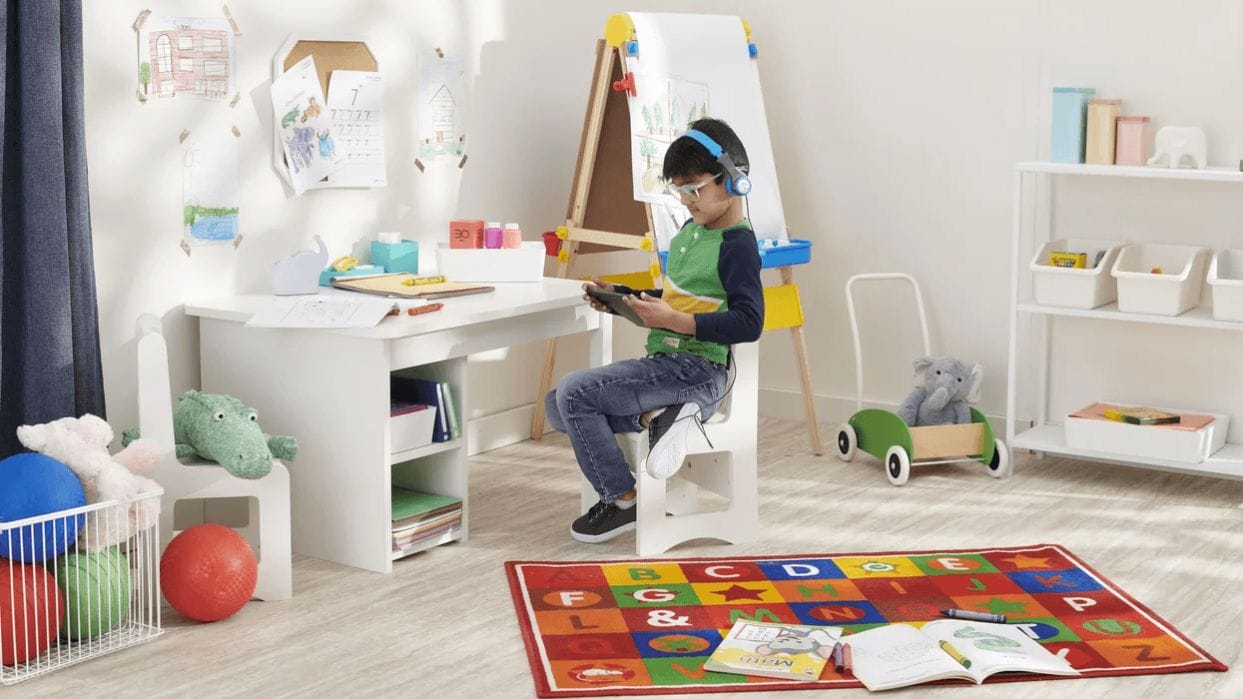 Teacher-approved tips for making virtual learning a success kid doing virtual school at a desk