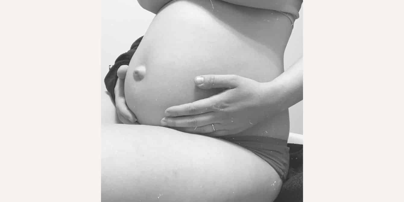 Maggie on having prenatal depression and being afraid to have another baby black and white photo of a pregnant belly - essay on prenatal depression