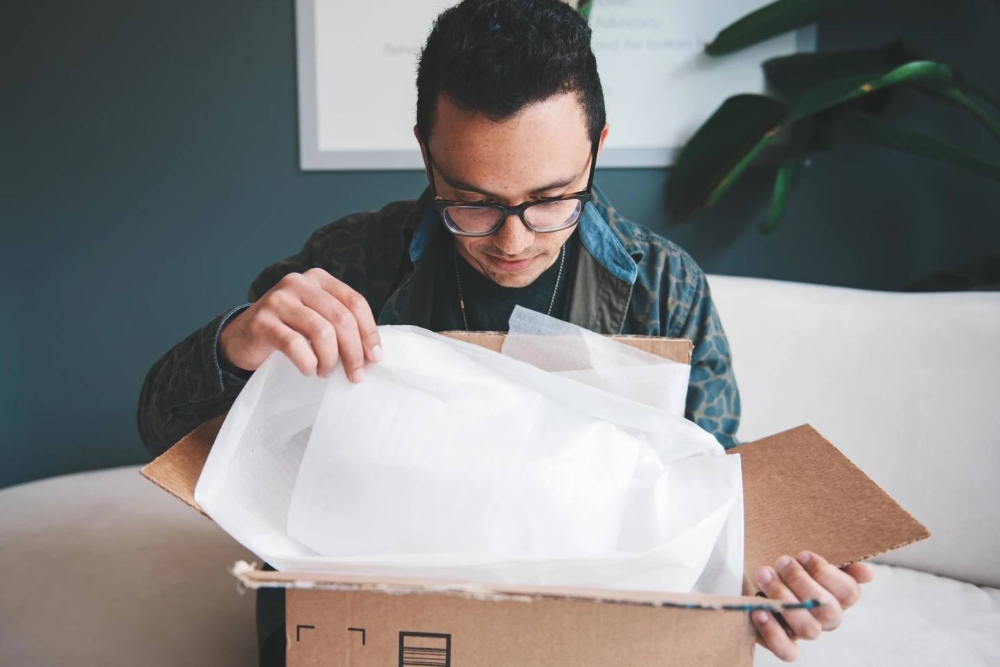 18 personalized Father’s Day gifts that prove you’re really thinking ahead man opening a box