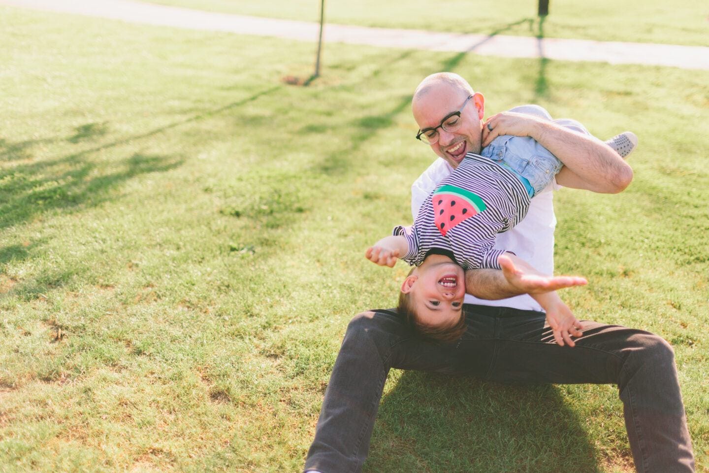 40+ of the best Father’s Day gifts for every dad on your list this year dad playing with son in the grass