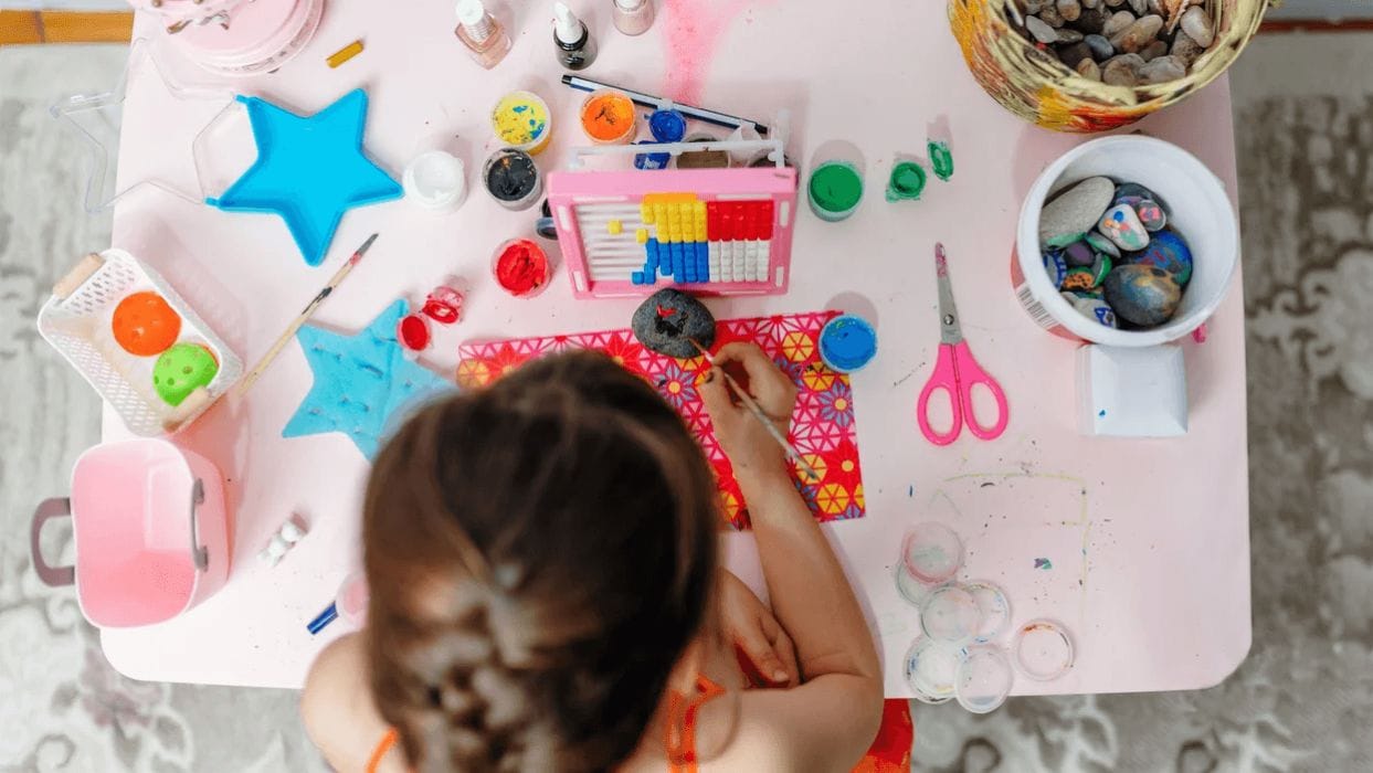 11 outdoor art toys that will keep your little one creatively entertained this summer little girl painting rocks