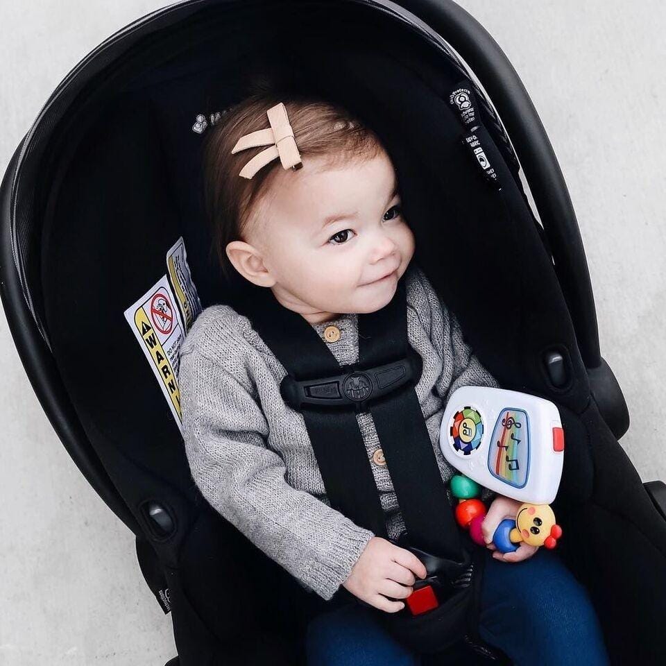 10 car seat guidelines every parent needs to know Baby girl sitting in a car seat - car seat guidelines