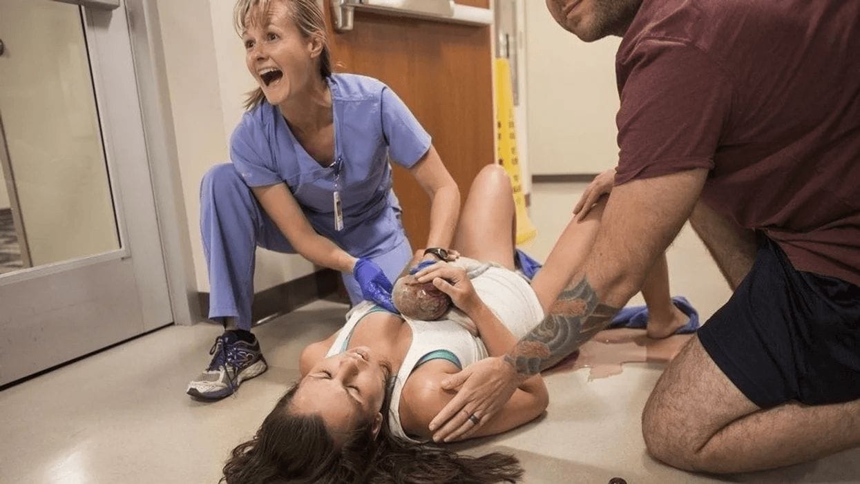 mom laying on the hospital floor after delivering her baby