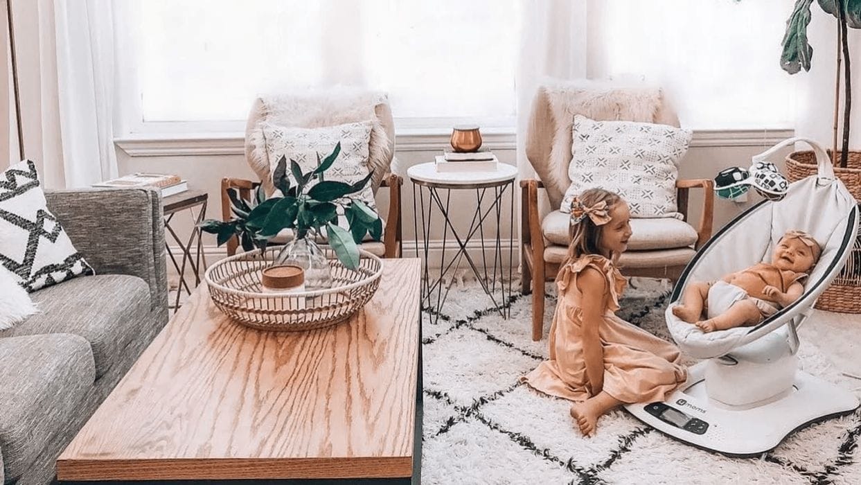 11 splurge-worthy items for your baby registry that are totally worth it toddler sibling playing with newborn sibling