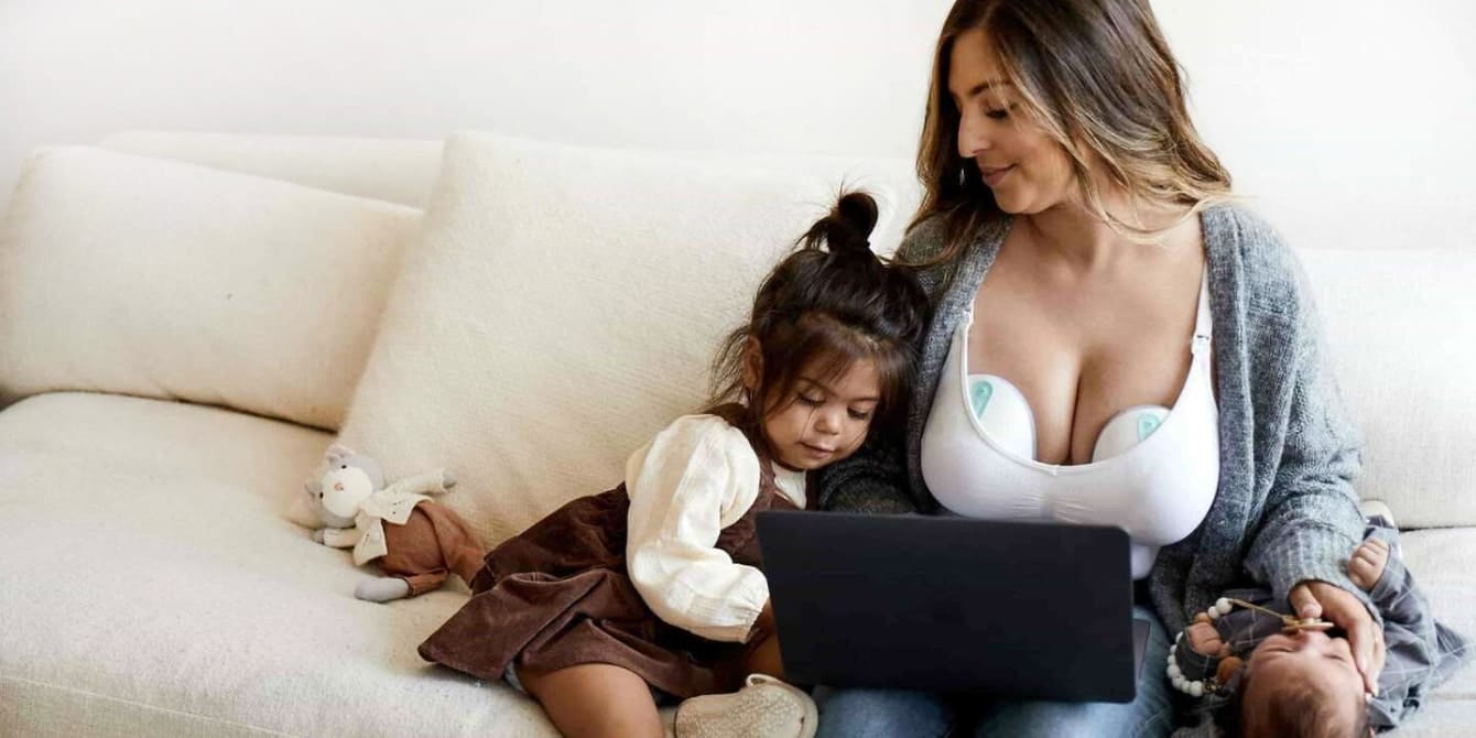 Common breastfeeding challenges and the products we swear by to help solve them mom-with-baby-and-toddler-wearing-breastpump