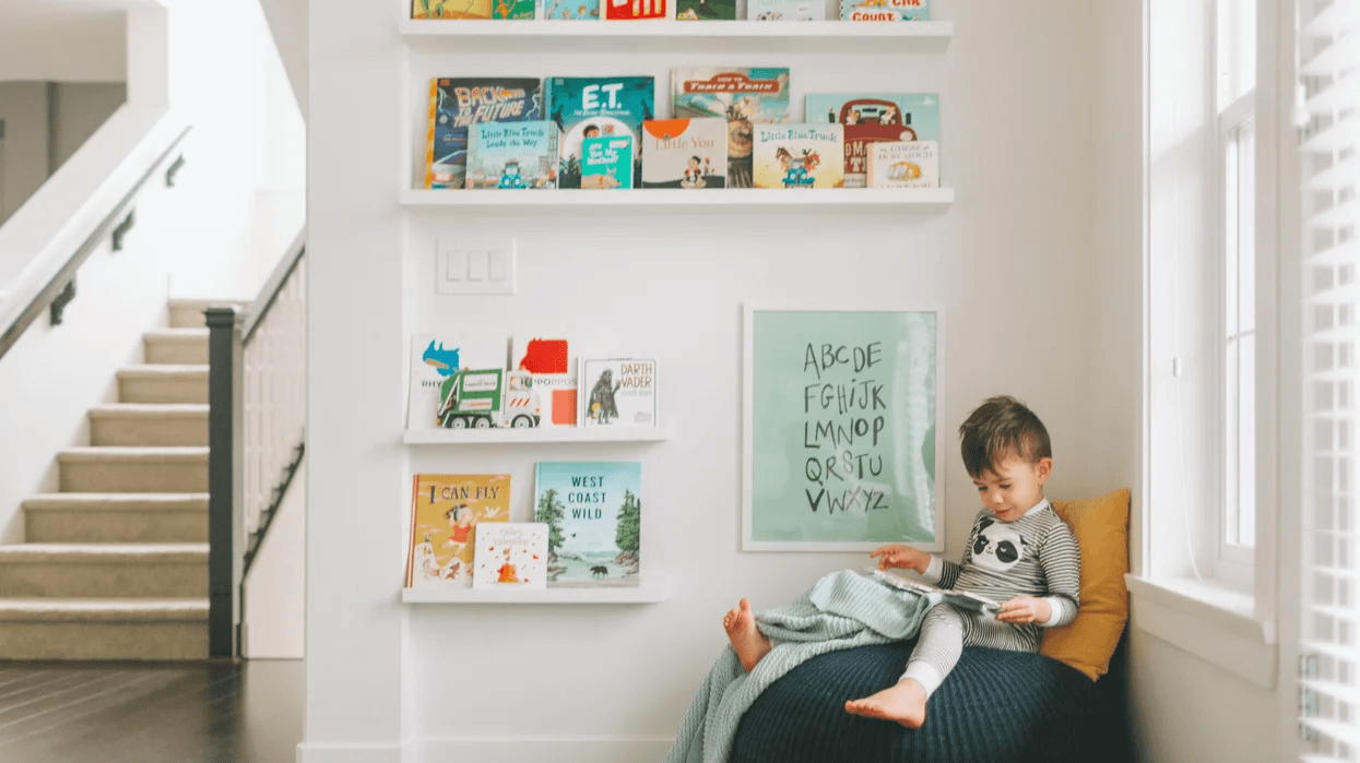5 educational quiet toys to foster independent play in toddlers little boy reading a book