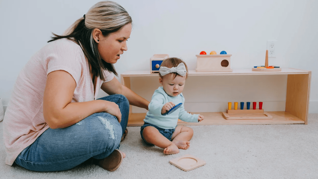 Montessori for babies: An overview mom using montessori baby principles to play with her child at home