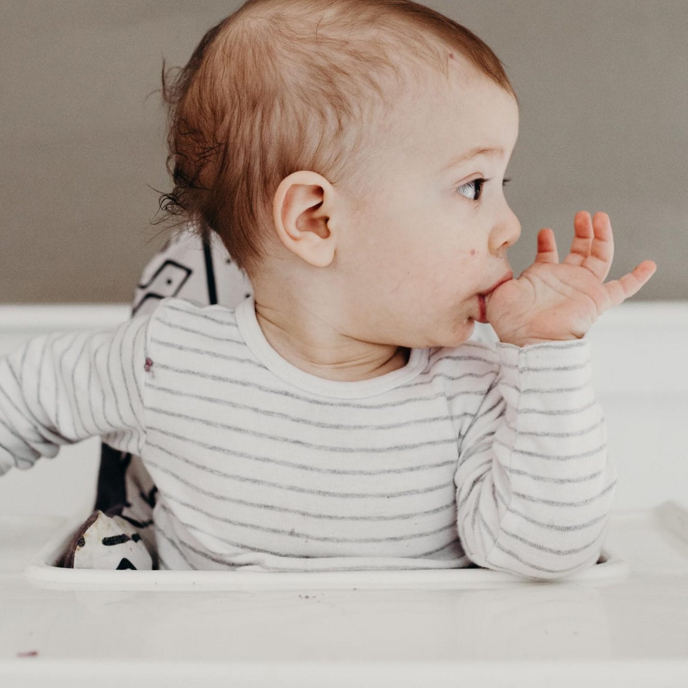 11-month-old baby feeding schedule & expert advice baby eating food from its finger - 11-month-old baby feeding schedule
