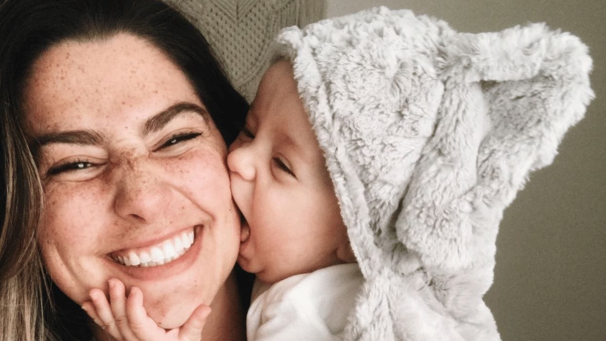 9-month-old baby milestones baby kissing moms face - 9-month milestones for baby