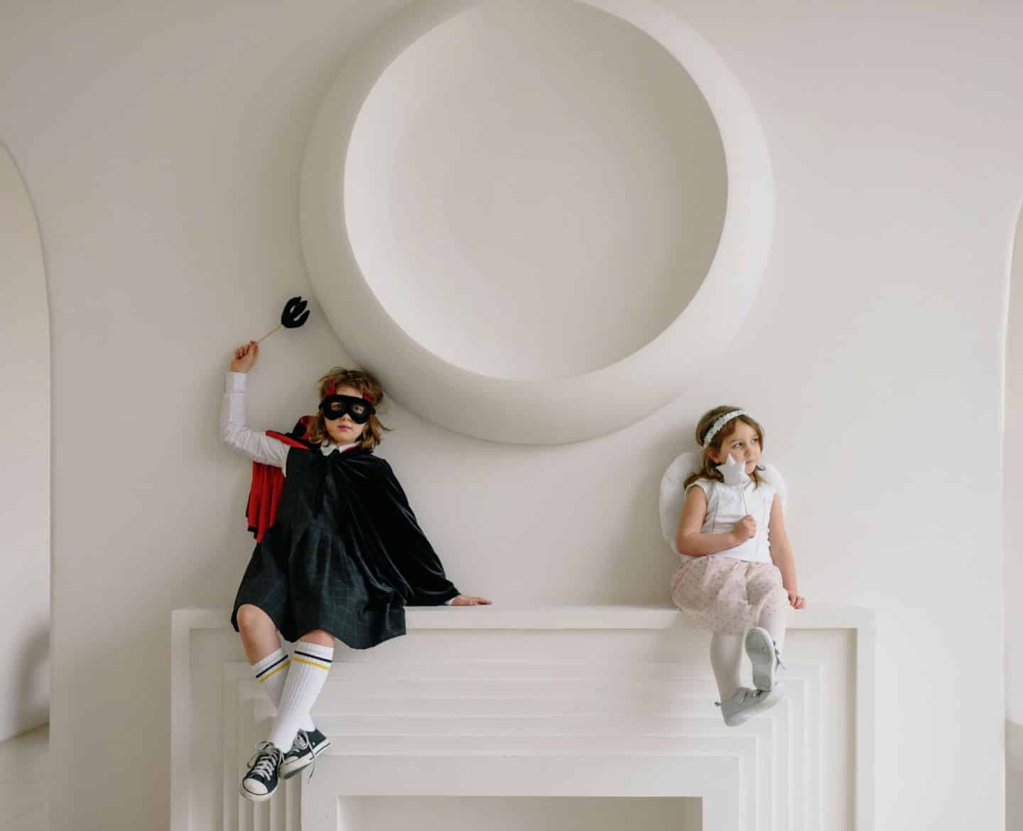 25+ Halloween costumes from Amazon for babies, toddlers and kids Two kids in Halloween costumes sitting on a mantle